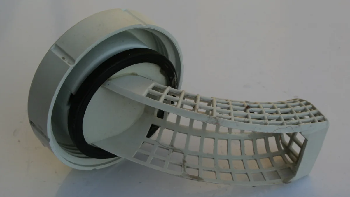Uitgenomen pluizenfilter van een wasmachine